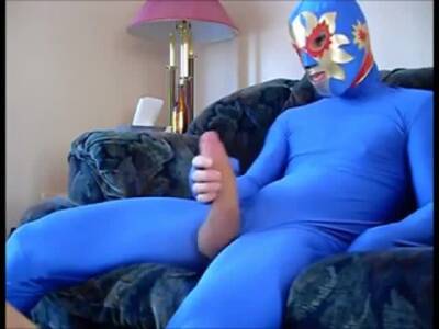 dude in mask a blue zentia suit strokes his big cock - fetishpapa.com